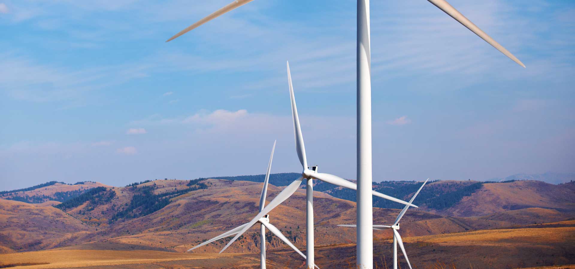 windmills with mountains in the background